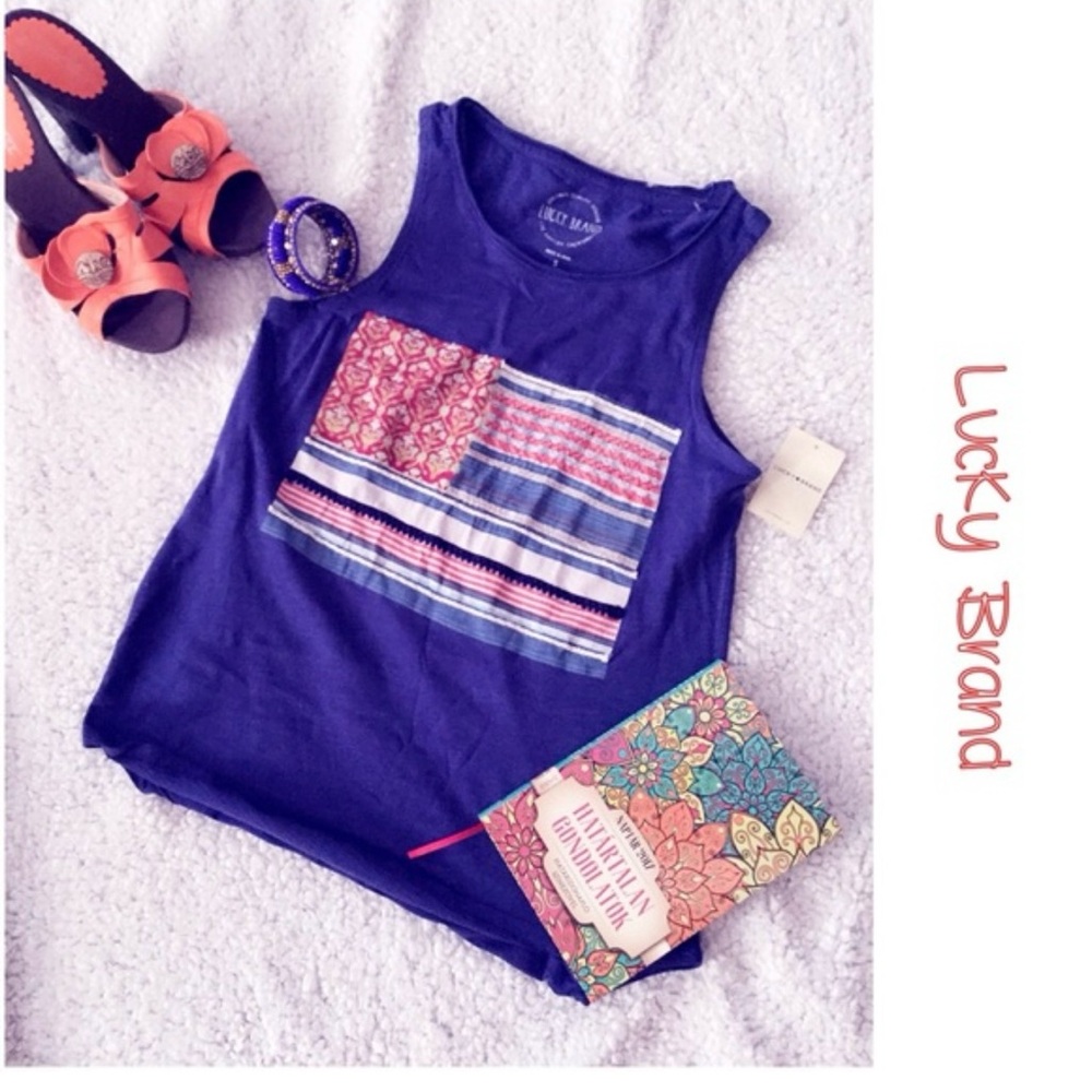 Blue sleeveless top 
Listing for Victoria